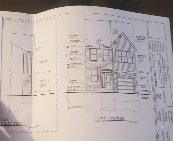 Architectural blueprint of a townhouse front elevation for a construction project