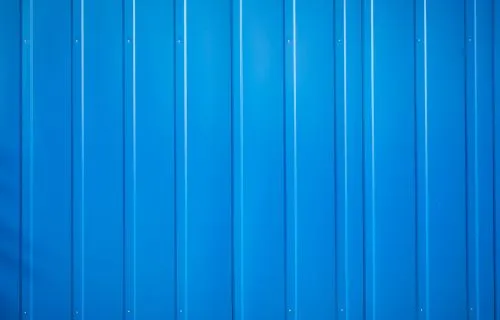 Close-up of blue vertical aluminum siding panels